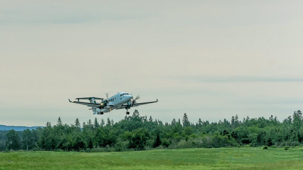 image of plane flying in canada private charter cargo